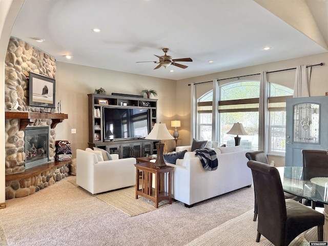 617 Lucille Cir, Evanston, WY 82930 - living room with a ceiling fan, carpet, a fireplace, and recessed lighting
