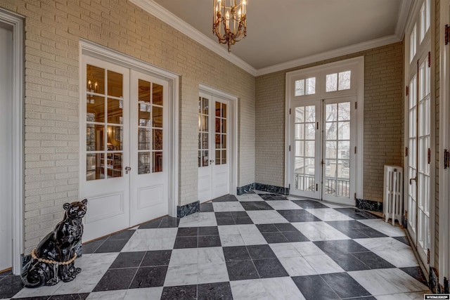 1108 S Wolcott St, Casper, WY 82601 - unfurnished sunroom featuring french doors and a chandelier