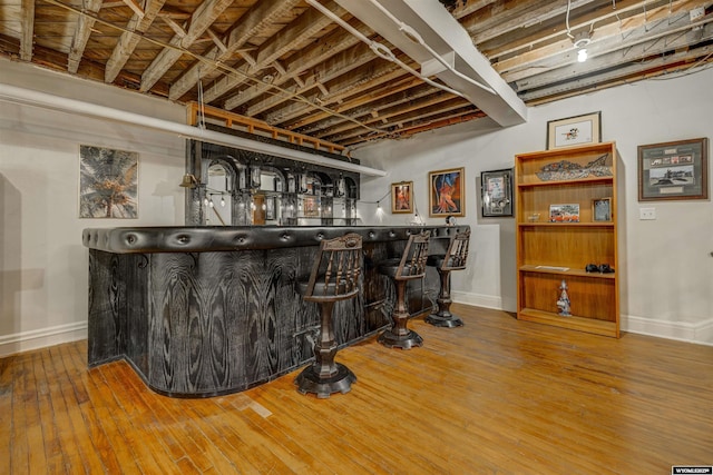 1108 S Wolcott St, Casper, WY 82601 - indoor dry bar with baseboards and wood-type flooring