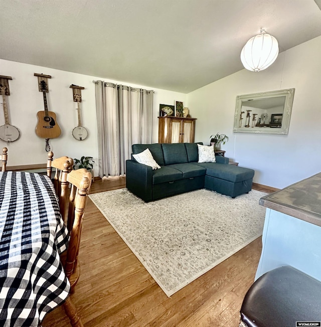 720 S 16th St, Worland, WY 82401 - living area featuring lofted ceiling and wood finished floors