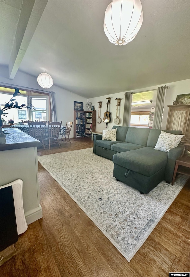 720 S 16th St, Worland, WY 82401 - living area with plenty of natural light, dark wood-type flooring, and beam ceiling