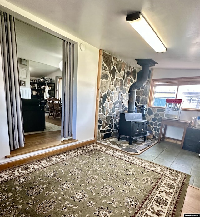 720 S 16th St, Worland, WY 82401 - interior space with a wood stove and tile patterned floors