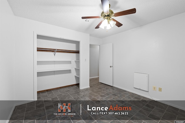 396 Williams Way, Glenrock, WY 82637 - unfurnished bedroom featuring a closet, a textured ceiling, ceiling fan, and baseboards