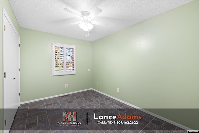 396 Williams Way, Glenrock, WY 82637 - unfurnished bedroom featuring a textured ceiling, a ceiling fan, and baseboards