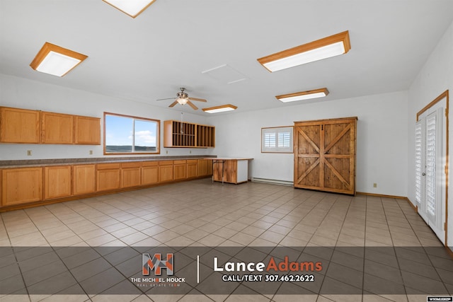 396 Williams Way, Glenrock, WY 82637 - kitchen with a baseboard radiator, light tile patterned floors, and a ceiling fan