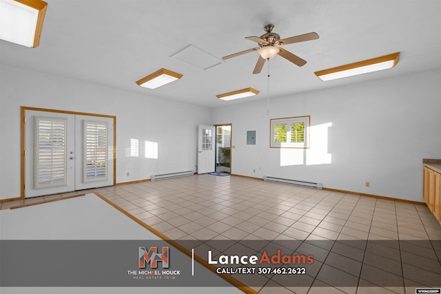 396 Williams Way, Glenrock, WY 82637 - tiled spare room with a baseboard radiator, ceiling fan, baseboards, and electric panel