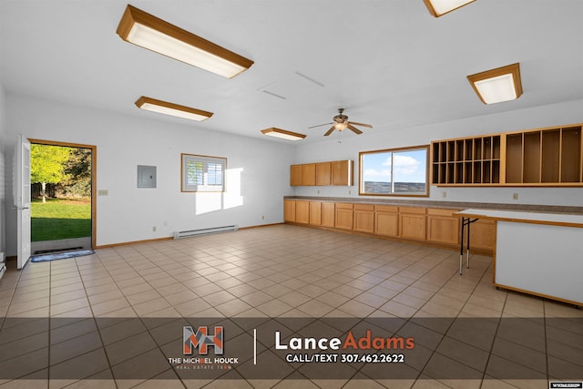 396 Williams Way, Glenrock, WY 82637 - kitchen with a baseboard radiator, electric panel, light tile patterned floors, ceiling fan, and light countertops