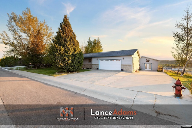396 Williams Way, Glenrock, WY 82637 - ranch-style home with driveway and french doors
