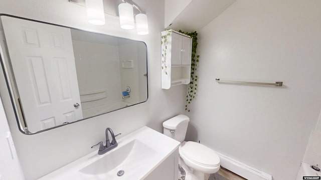 205 Daffodil, Casper, WY 82604 - bathroom featuring baseboard heating, toilet, vanity, and a shower