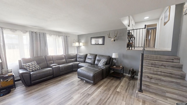 205 Daffodil, Casper, WY 82604 - living area with wood finished floors, stairway, baseboards, and recessed lighting