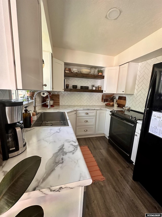 1595 S Riverbend Dr, Green River, WY 82935 - kitchen with black appliances, a sink, open shelves, backsplash, and light stone counters