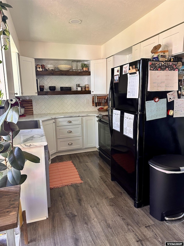 1595 S Riverbend Dr, Green River, WY 82935 - kitchen with black appliances, open shelves, dark wood finished floors, backsplash, and white cabinetry