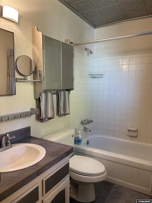 715 Emerald St, Kemmerer, WY 83101 - full bathroom with toilet, tile patterned floors, shower / bathtub combination, and vanity