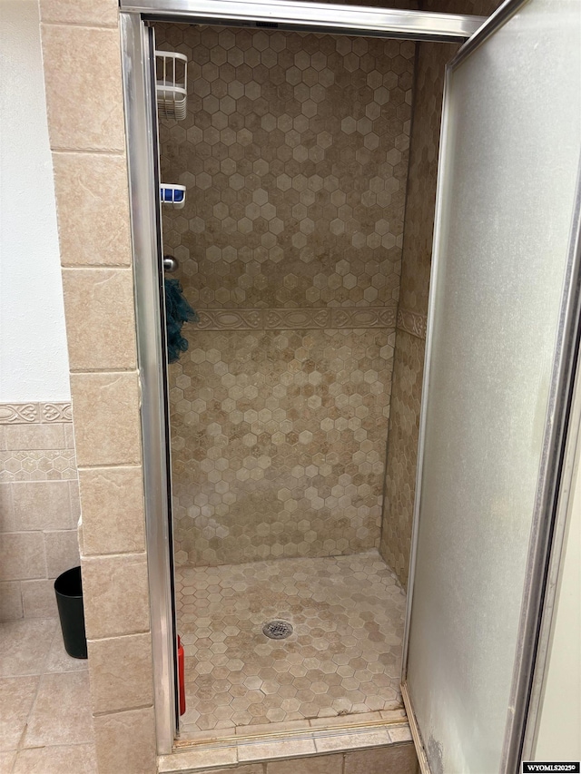 715 Emerald St, Kemmerer, WY 83101 - full bathroom with a stall shower and tile patterned floors