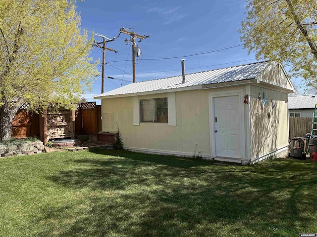 715 Emerald St, Kemmerer, WY 83101 - back of house featuring metal roof and an outdoor structure