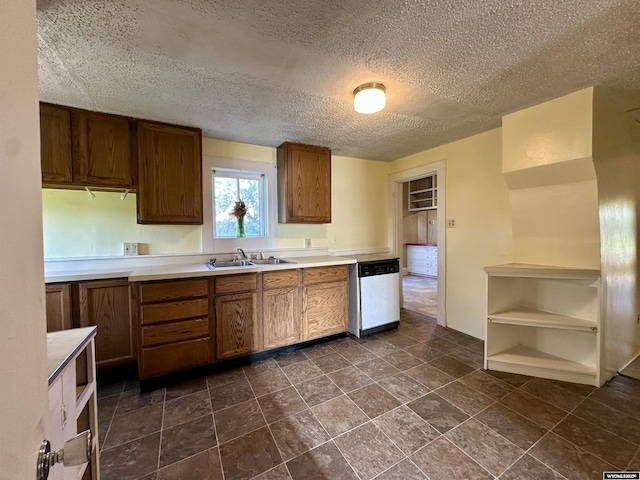 596 Garfield St, Lander, WY 82520 - kitchen featuring dishwasher, a sink, open shelves, brown cabinets, and light countertops