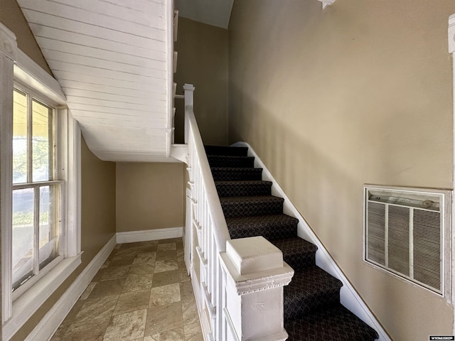 596 Garfield St, Lander, WY 82520 - stairs featuring baseboards, stone finish floors, and lofted ceiling