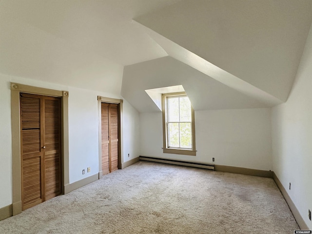 596 Garfield St, Lander, WY 82520 - bonus room featuring baseboard heating, carpet floors, lofted ceiling, and baseboards