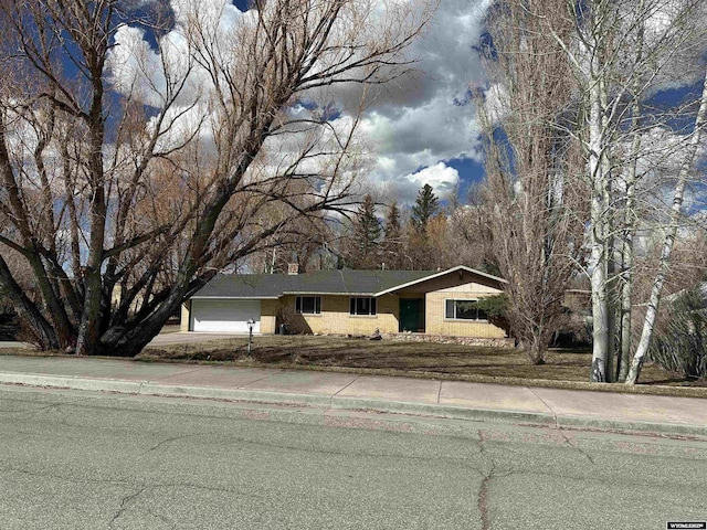 104 First St, Mountain View, WY 82939 - ranch-style home featuring a garage and concrete driveway