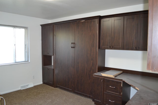 104 First St, Mountain View, WY 82939 - unfurnished office featuring carpet, built in study area, and baseboards