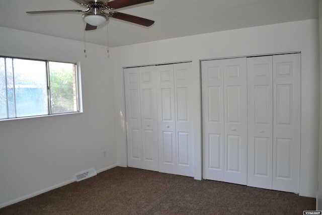104 First St, Mountain View, WY 82939 - unfurnished bedroom with carpet floors, two closets, and ceiling fan