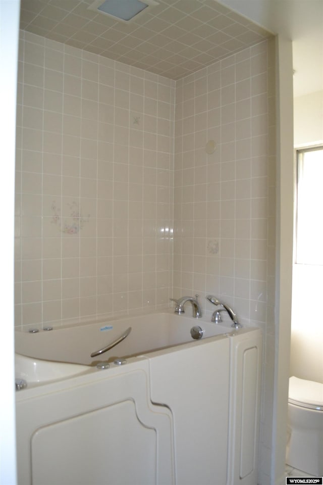 104 First St, Mountain View, WY 82939 - bathroom featuring toilet and a tub to relax in