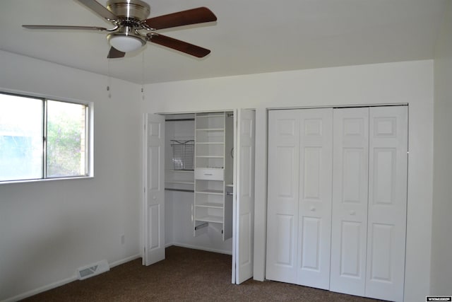 104 First St, Mountain View, WY 82939 - unfurnished bedroom featuring dark carpet, multiple closets, ceiling fan, and baseboards