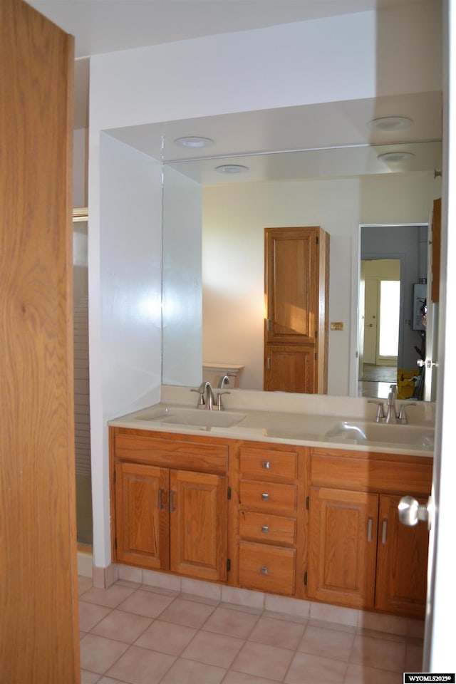 104 First St, Mountain View, WY 82939 - full bath with double vanity and tile patterned floors