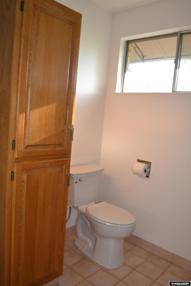 104 First St, Mountain View, WY 82939 - bathroom with toilet, tile patterned floors, and baseboards