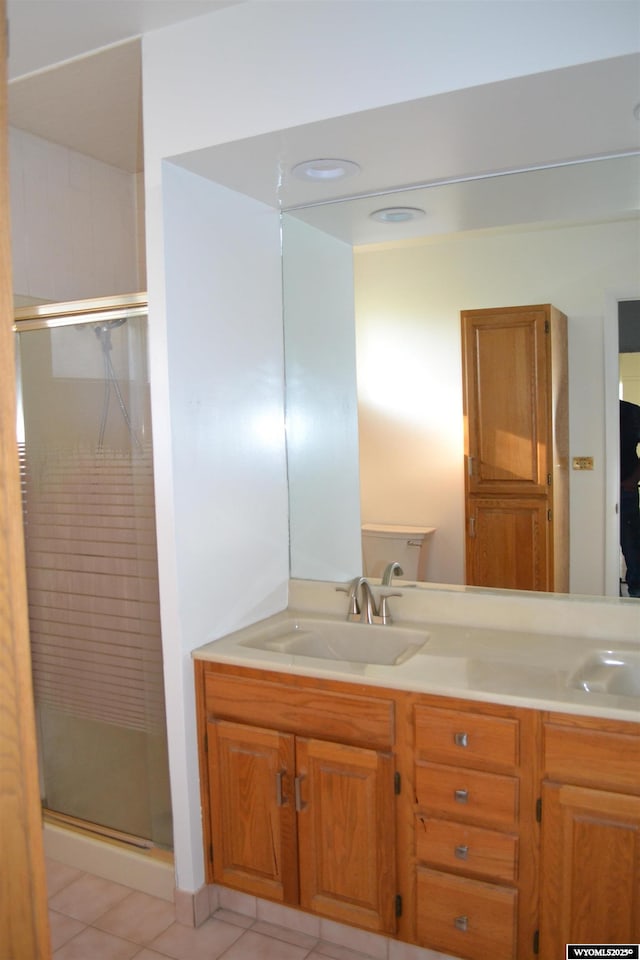 104 First St, Mountain View, WY 82939 - bathroom featuring a stall shower, double vanity, and tile patterned floors
