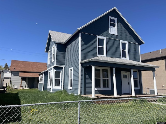 1137 Main St, Evanston, WY 82930 - view of front facade with a porch and roof with shingles