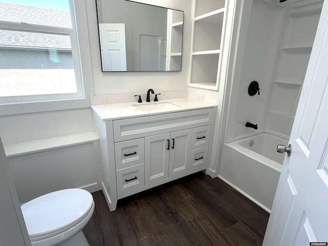 1137 Main St, Evanston, WY 82930 - full bathroom with wood finished floors, vanity, toilet, and  shower combination