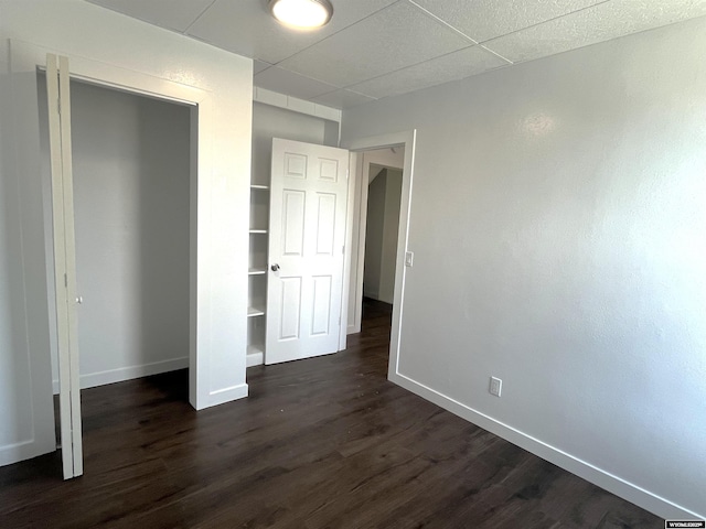 1137 Main St, Evanston, WY 82930 - unfurnished bedroom with baseboards, dark wood finished floors, and a closet