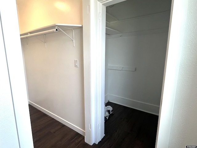 1137 Main St, Evanston, WY 82930 - walk in closet with dark wood-style flooring and attic access