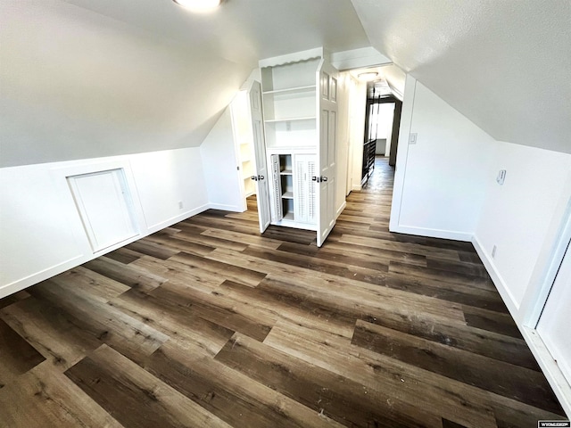 1137 Main St, Evanston, WY 82930 - bonus room with lofted ceiling, dark wood-style flooring, and baseboards