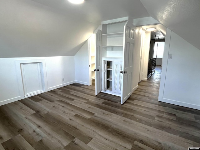 1137 Main St, Evanston, WY 82930 - additional living space featuring lofted ceiling, dark wood finished floors, and baseboards