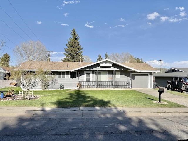 921 3RD W Ave, Kemmerer, WY 83101 - ranch-style house featuring an attached garage, a front yard, concrete driveway, and covered porch