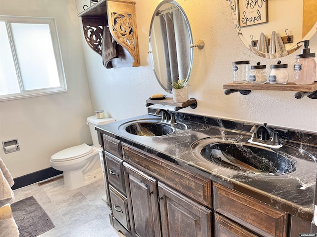 921 3RD W Ave, Kemmerer, WY 83101 - bathroom featuring toilet and double vanity