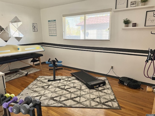 921 3RD W Ave, Kemmerer, WY 83101 - exercise area featuring wood finished floors and baseboards