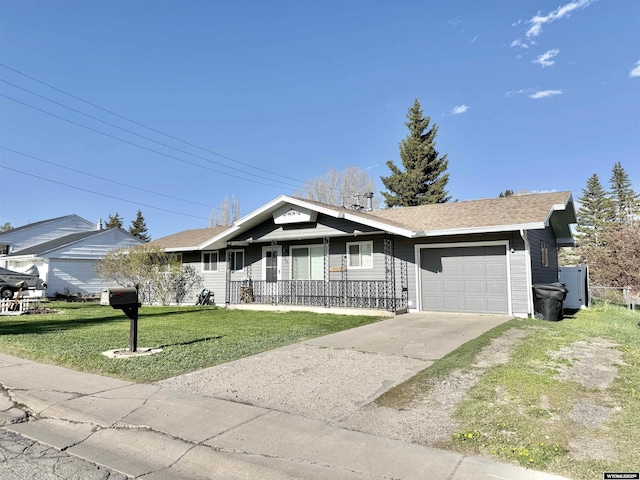 921 3RD W Ave, Kemmerer, WY 83101 - single story home with a garage, driveway, a front yard, and a porch