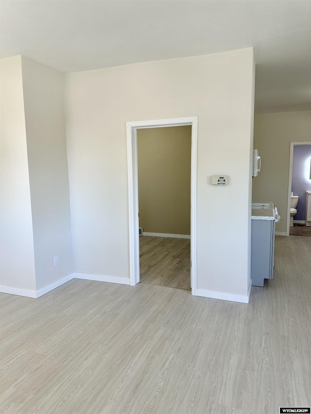 401 Quartz St, Kemmerer, WY 83101 - empty room with light wood-style floors and baseboards