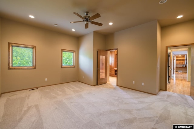 370 Aster, Casper, WY 82604 - unfurnished bedroom featuring light colored carpet, recessed lighting, baseboards, and ensuite bathroom