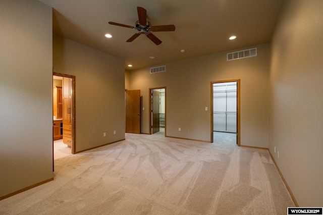 370 Aster, Casper, WY 82604 - unfurnished bedroom featuring recessed lighting, light carpet, a spacious closet, baseboards, and connected bathroom