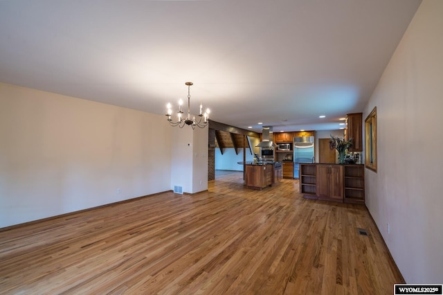 370 Aster, Casper, WY 82604 - unfurnished living room with light wood finished floors, a chandelier, baseboards, and recessed lighting