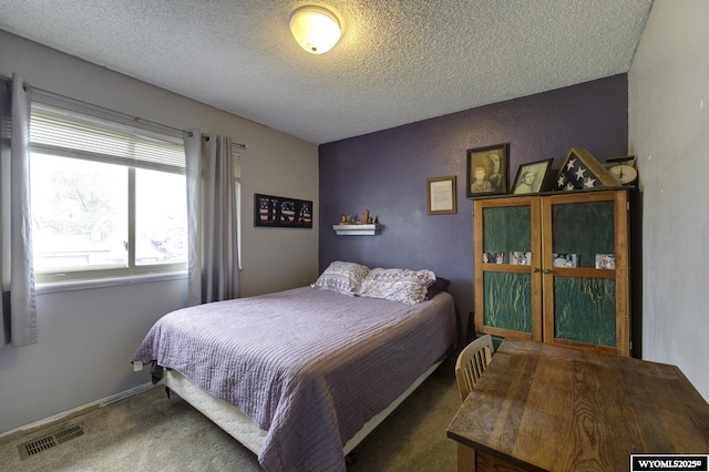 363 Oleander St, Casper, WY 82604 - carpeted bedroom featuring a textured ceiling