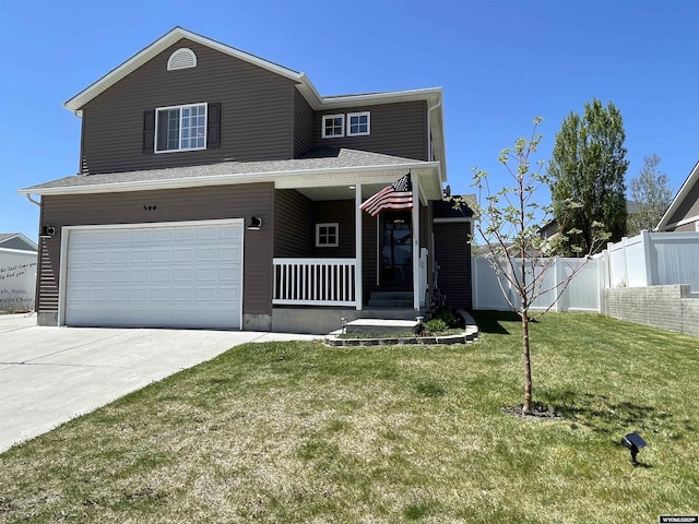 344 Via Assisi Dr, Rock Springs, WY 82901 - view of front of property with a porch, an attached garage, and concrete driveway