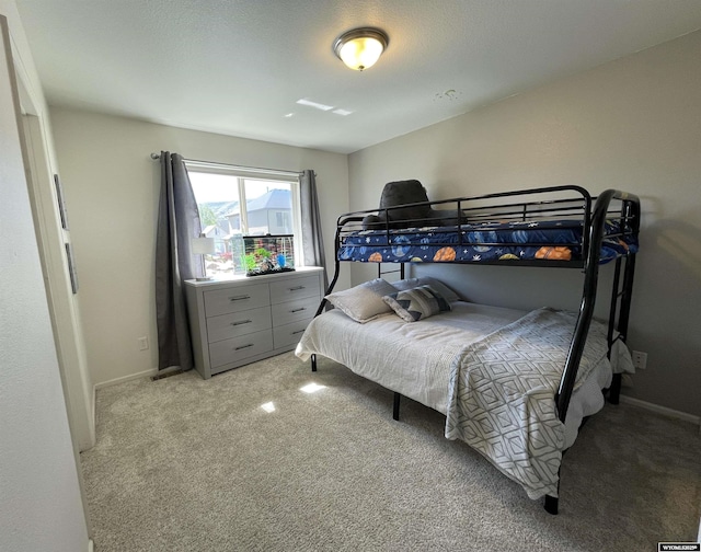 344 Via Assisi Dr, Rock Springs, WY 82901 - bedroom with light carpet and baseboards