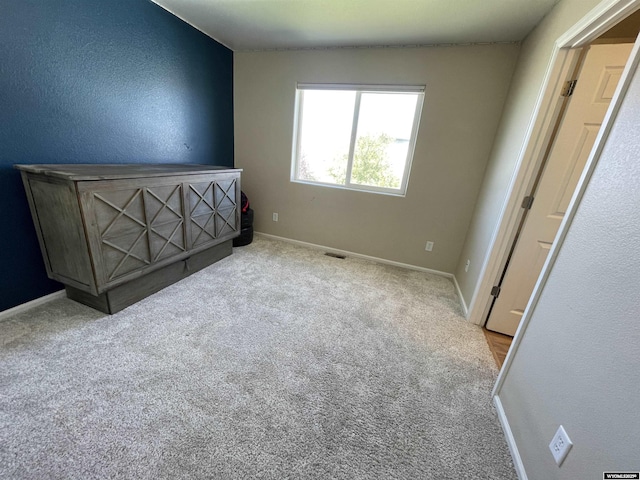 344 Via Assisi Dr, Rock Springs, WY 82901 - unfurnished bedroom with baseboards and carpet