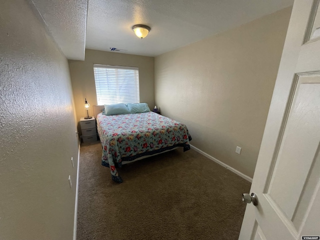 344 Via Assisi Dr, Rock Springs, WY 82901 - bedroom with carpet, baseboards, and a textured ceiling