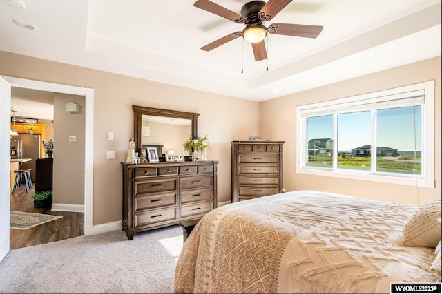 1291 Eagle View Dr, Buffalo, WY 82834 - bedroom featuring a raised ceiling, baseboards, wood finished floors, carpet flooring, and ceiling fan